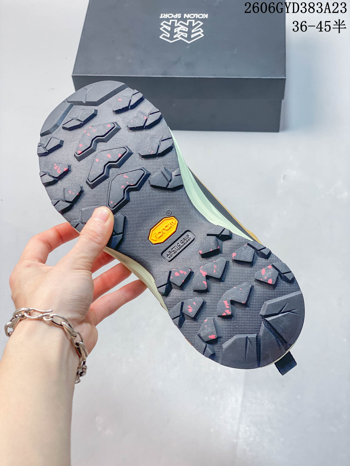 Close-up of the lugged outsole with a Vibram Megagrip marking.