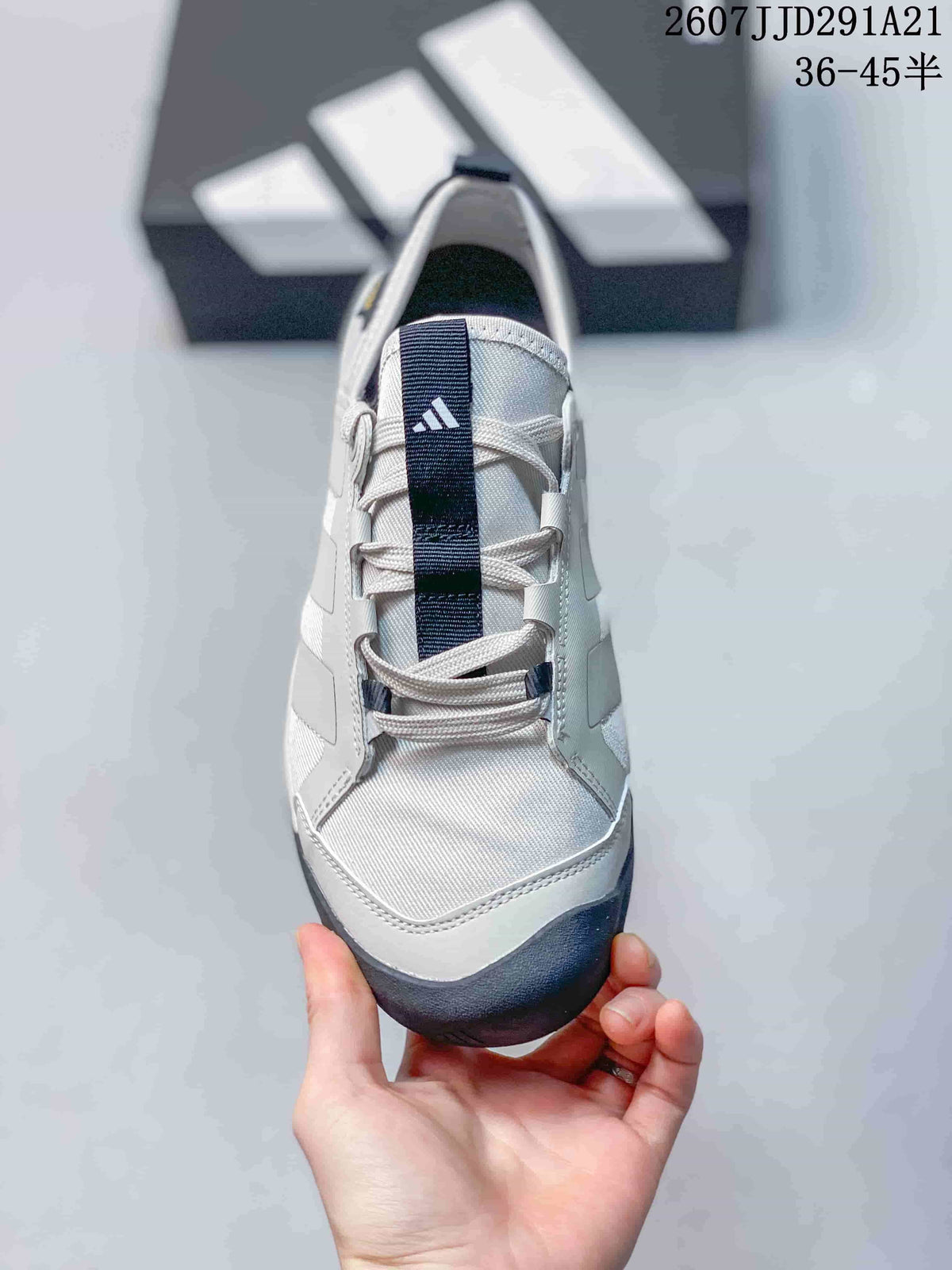 Front view showing the white toe area, laces and navy tongue detail.