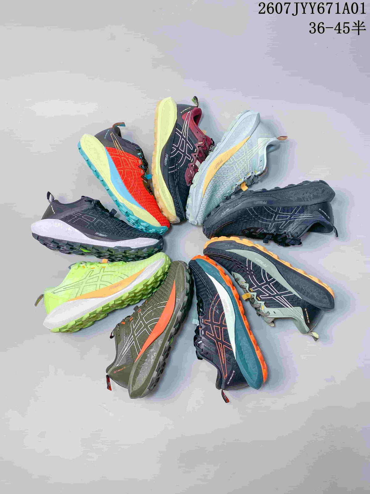 Several ASICS GEL-TRABUCO 13 trail shoes shown in different colors