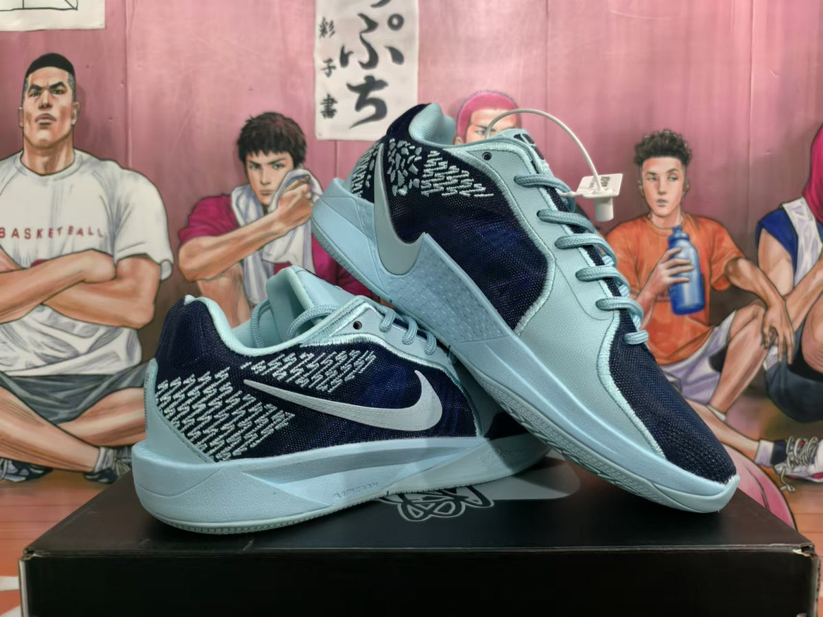 Two blue and black Nike Kobe basketball shoes shown at an angle