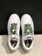Top view of the pair showing perforated toe boxes, camouflage laces, tongue branding, and camouflage insoles.