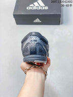 Rear view of the charcoal gray Adidas Adizero PR sneaker