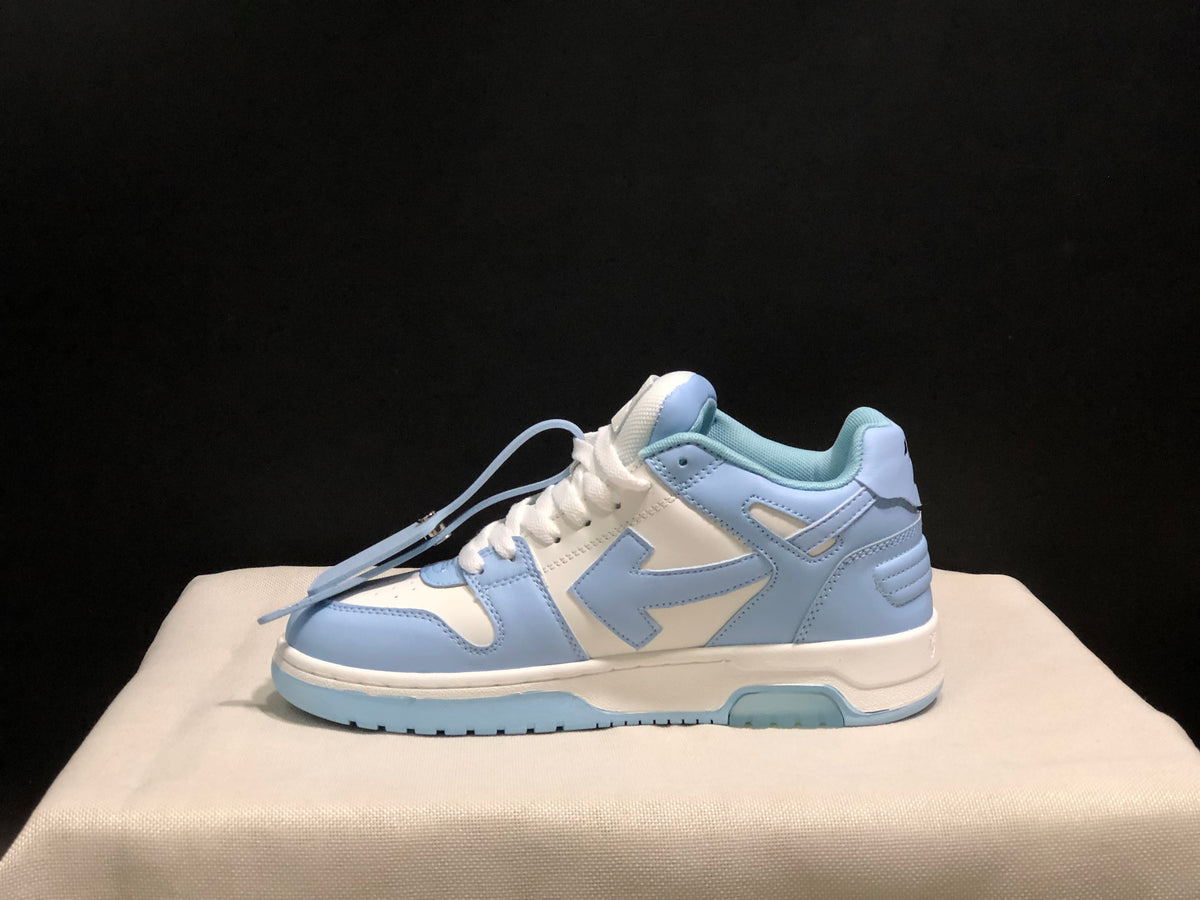 Side profile showing the low-top silhouette, layered panels, padded heel, and segmented outsole.