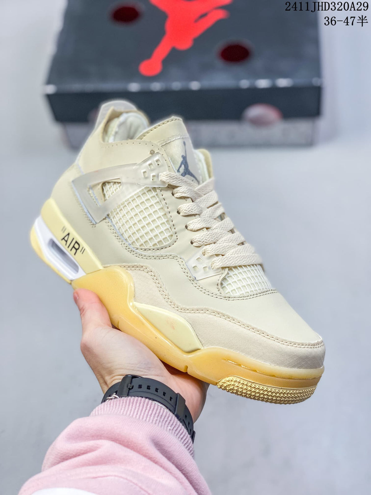 Angled close-up of the cream sneaker with mesh detailing, side wing, and visible air unit
