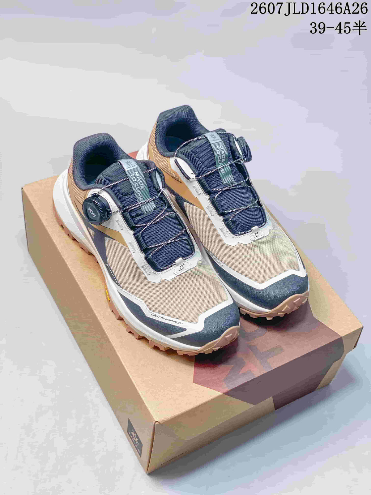 Pair of KAILAS Kuo Cang BOA low-top outdoor sneakers in navy, tan and white on a shoebox; source overlay shows style code 2607JLD1646A26 and size range 39–45.