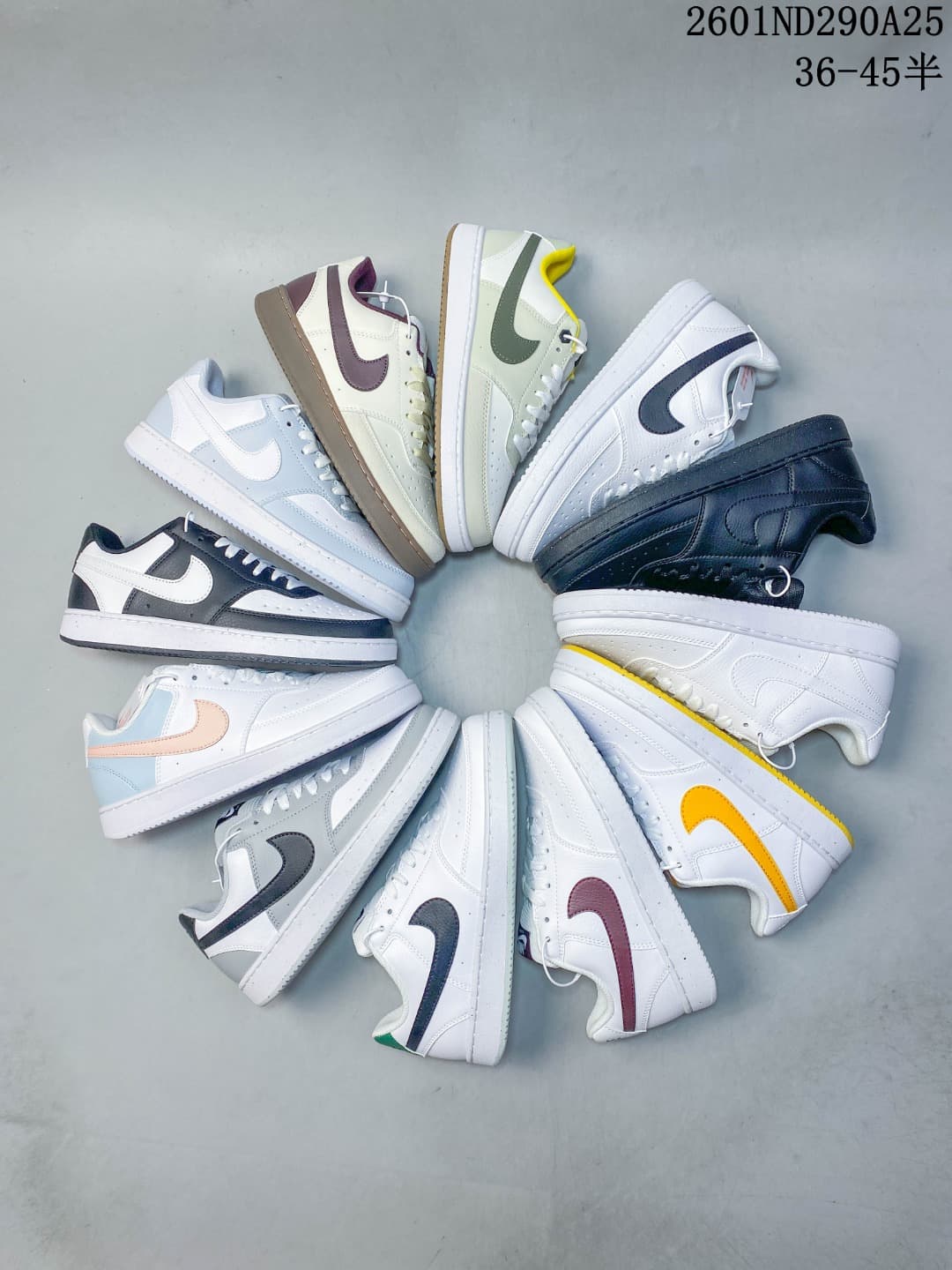Overhead arrangement of Nike Court Vision Low sneakers in a variety of color combinations.