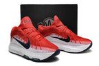 Pair of red and white Nike GT Hustle 3 shoes displayed in front of a box.