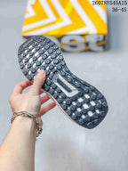 Close view of the dark patterned outsole on a white Adidas Ultraboost Light sneaker, with model code 2607NY545A15 and size range 36–45 visible above.