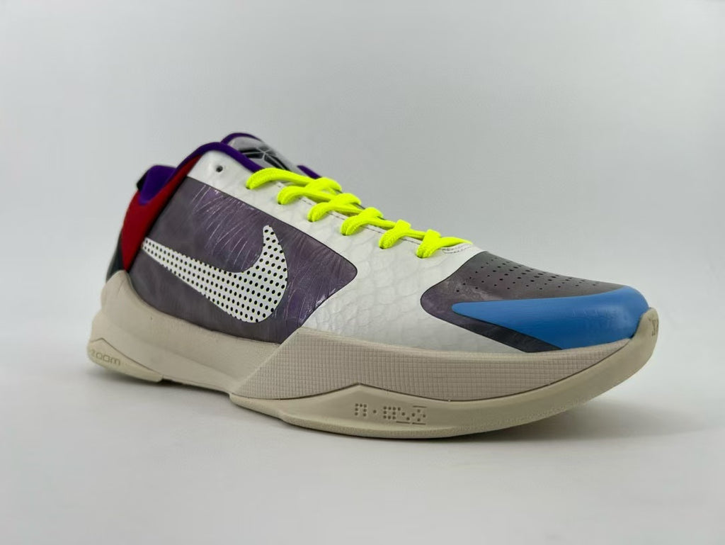 Side view of the shoe with dotted logo and bright laces