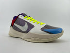 Side view of the shoe with dotted logo and bright laces