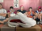 Side view showing the layered white panels and red midsole accent