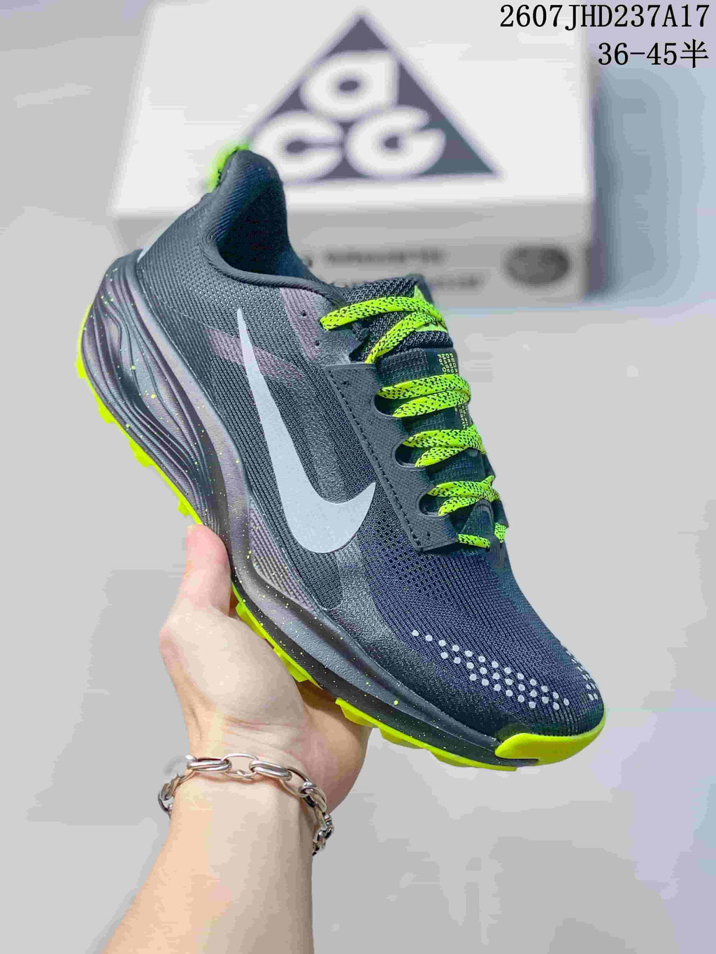 Angled side view of the shoe showing the Nike Swoosh, lime laces, and trail-style outsole.