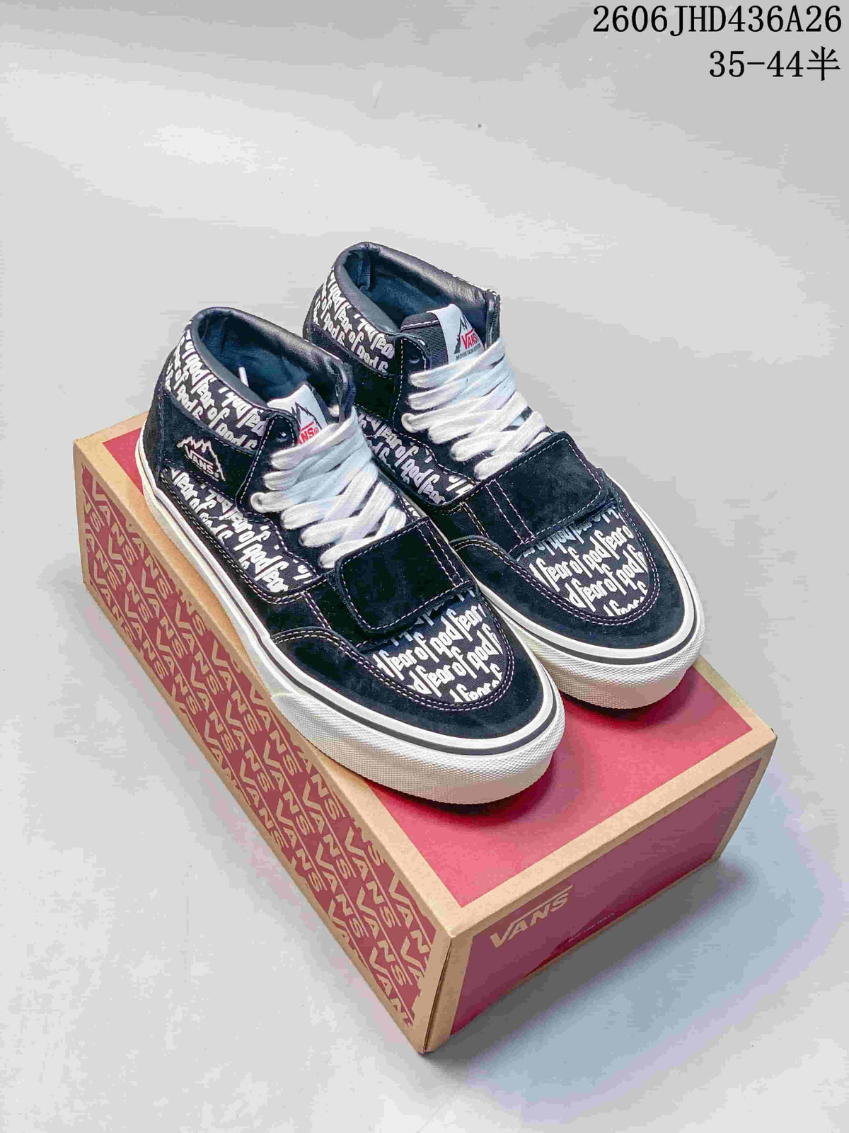Black-and-white Fear of God text-patterned Vans Era 95 Reissue sneakers displayed on a Vans box.