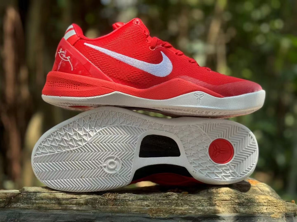Side and outsole view of red Nike Kobe 8 basketball shoes