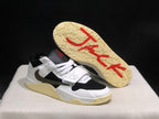 Sneaker outsole view showing the textured sail-colored sole and red printed graphics.