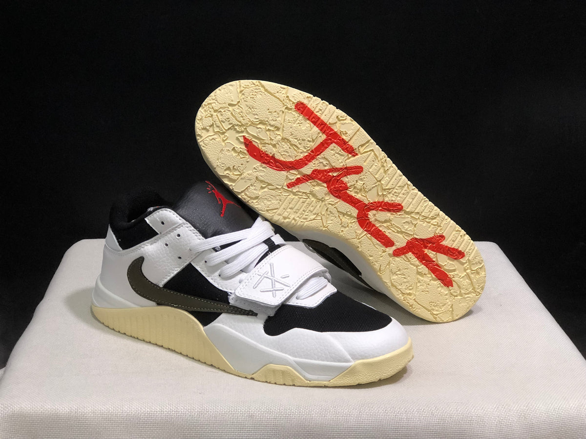 Sneaker outsole view showing the textured sail-colored sole and red printed graphics.