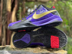Nike Kobe 5 shoes shown from the side and beneath, displaying the black outsole with purple and red details.