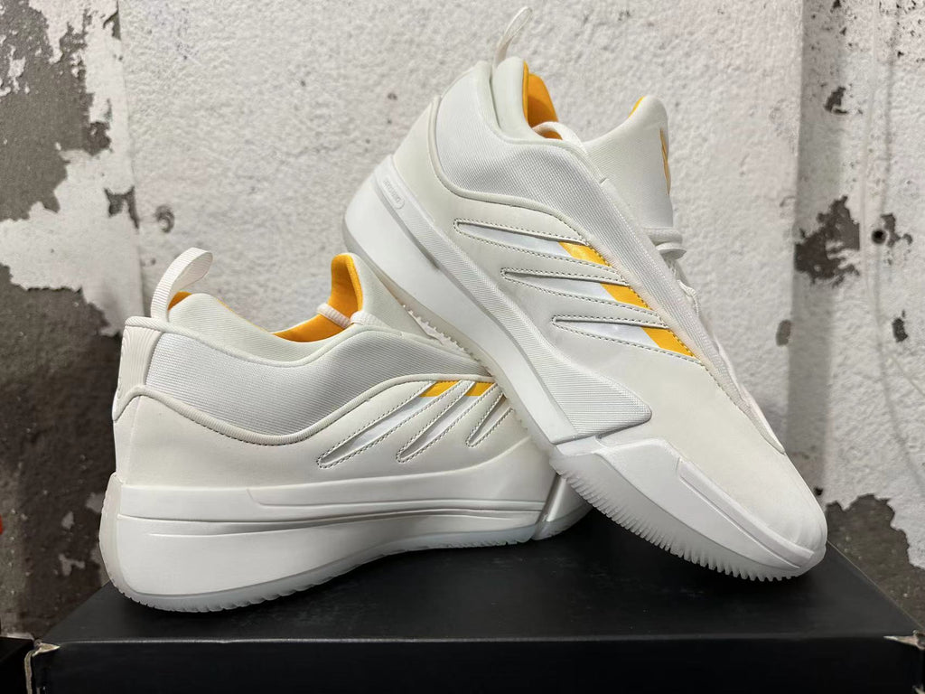Angled view of white Adidas Dame 9 basketball shoes