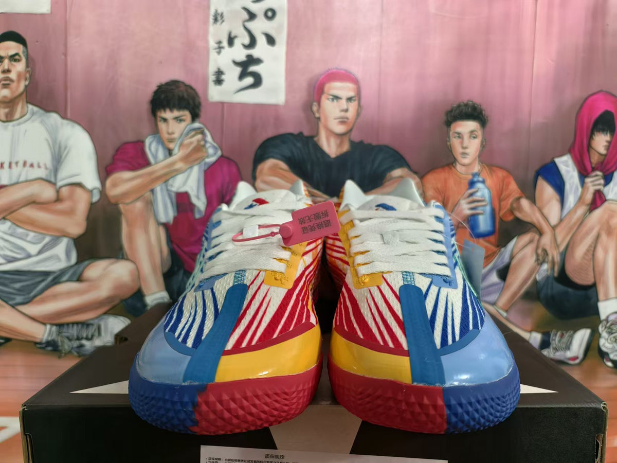 Front view of red and blue Converse basketball shoes with white laces and contrasting yellow details.