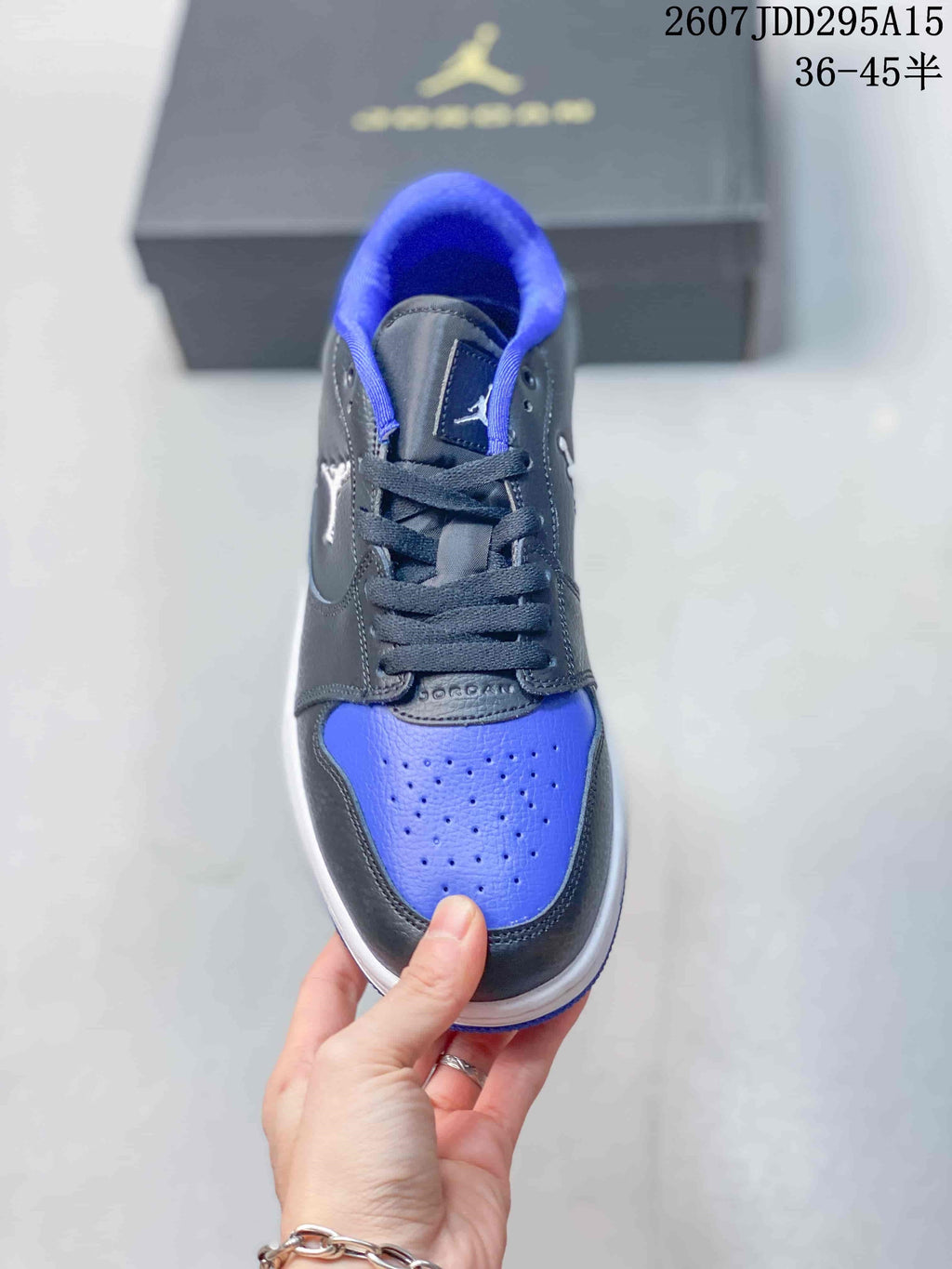 Top view showing black laces, blue perforated toe panel, and contrasting overlays.