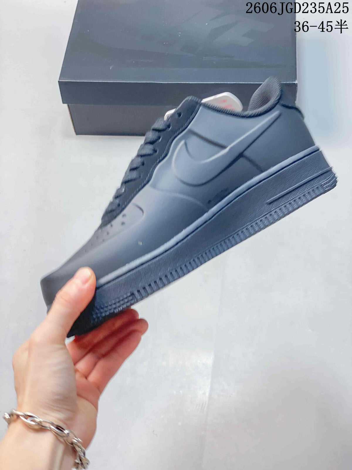 Side view showing the dark Nike Swoosh, low-top profile, layered midsole, and textured outsole.
