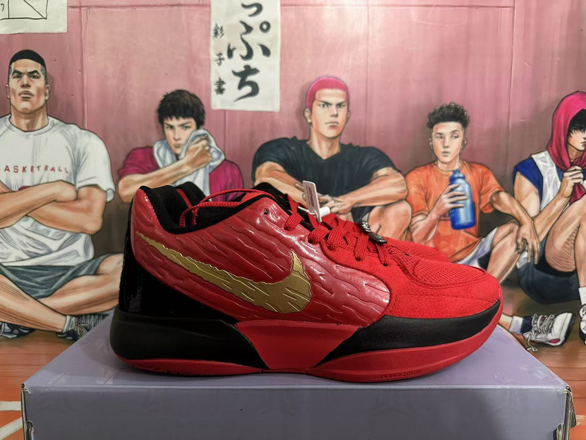 Side view of a red and black Nike basketball shoe with a gold-tone Swoosh