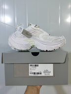White sneaker displayed on its box; the visible label includes model reference 9000, color WHITE, and size C 37.