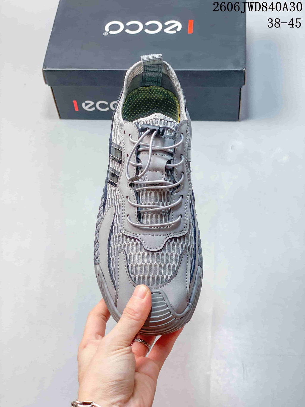 Top view of the gray lace-up sneaker and patterned mesh panels