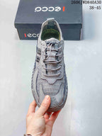 Top view of the gray lace-up sneaker and patterned mesh panels
