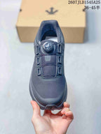 Top view of the black sneaker showing the mesh toe box, three overlay sections, and dial-based closure.