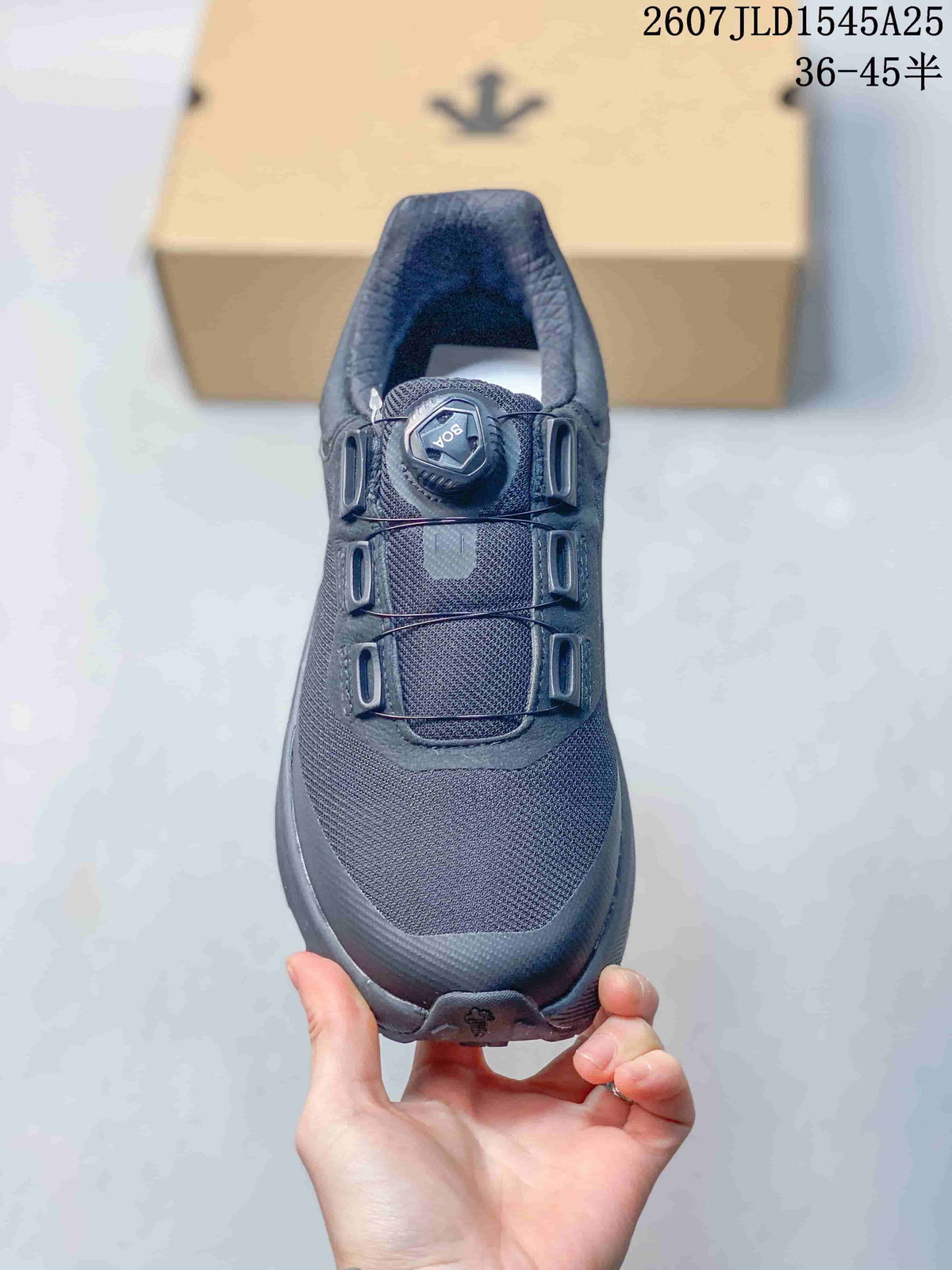 Top view of the black sneaker showing the mesh toe box, three overlay sections, and dial-based closure.