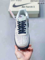 Top view showing the perforated white toe box, navy laces, and Air Force 1 tongue label.