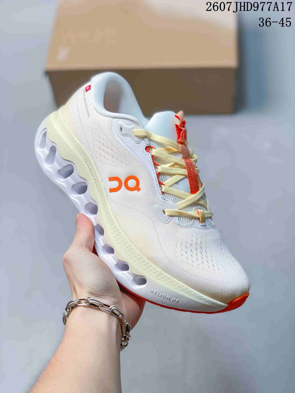 Side view of a white On Cloudtilt sneaker with orange accents and a light sculpted outsole.