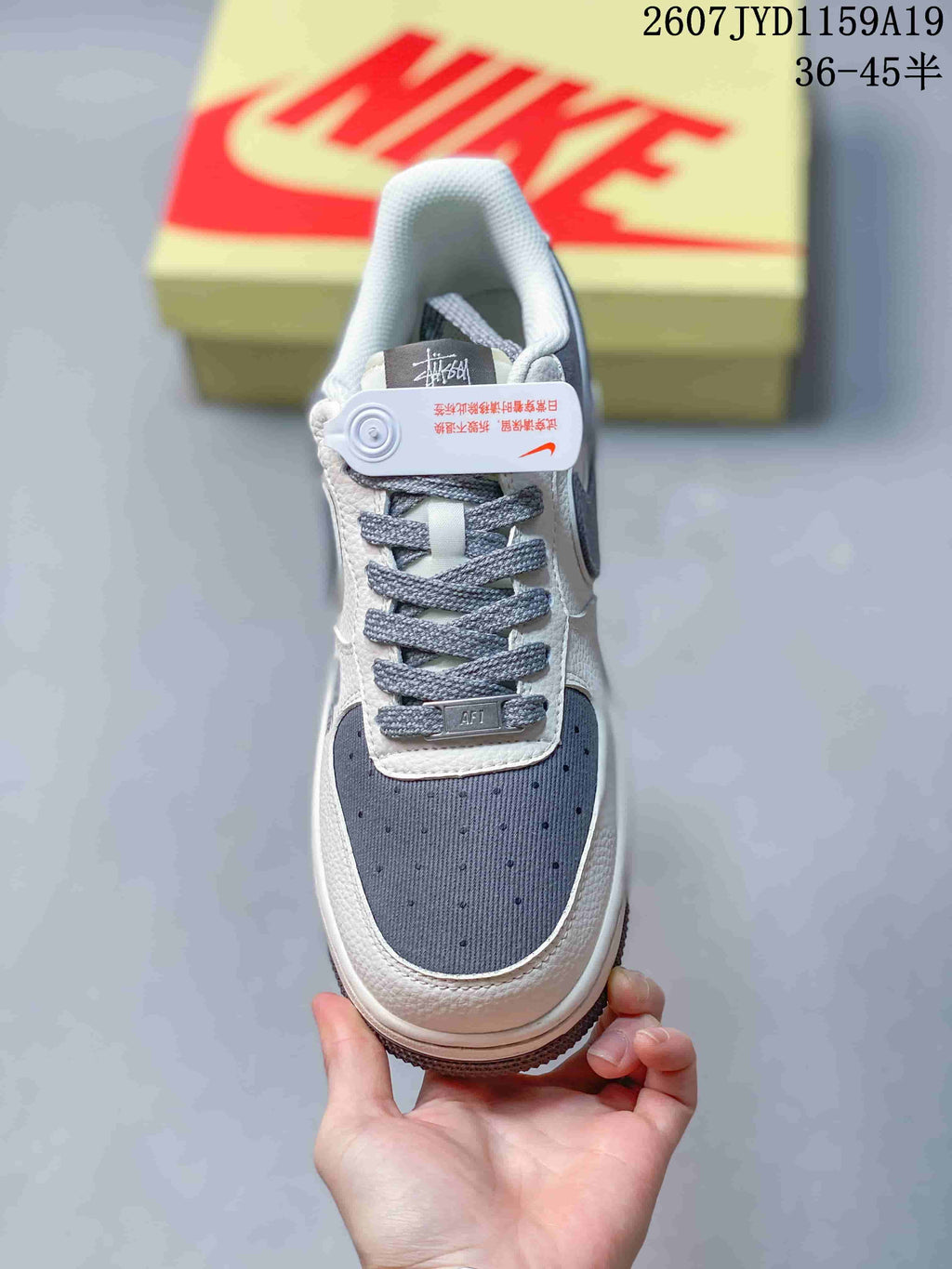 Top view showing the perforated gray toe box, gray laces and white leather-look panels.