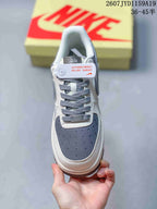 Top view showing the perforated gray toe box, gray laces and white leather-look panels.