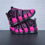 Pair of black and pink Nike Air More Uptempo sneakers shown from the side