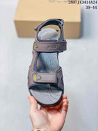 Top view of a single brown sandal showing the open toe, adjustable straps, and contoured footbed.