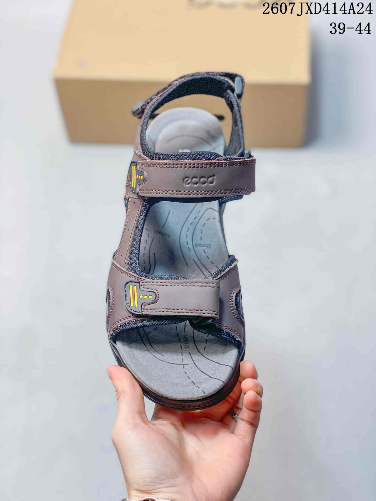 Top view of a single brown sandal showing the open toe, adjustable straps, and contoured footbed.