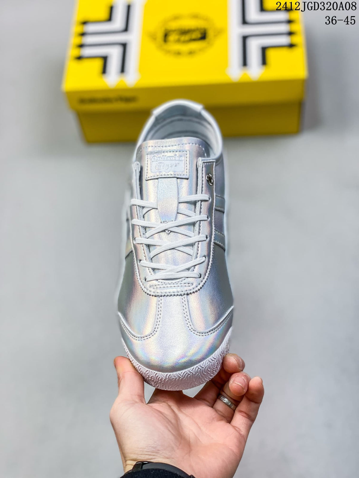 Top view of the sneaker showing the white laces, tongue label and reflective upper.
