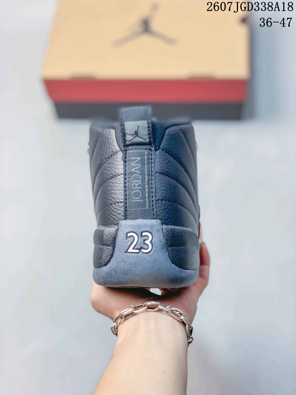 Rear view of the sneaker showing the Jordan heel detail, padded collar, and the number 23.