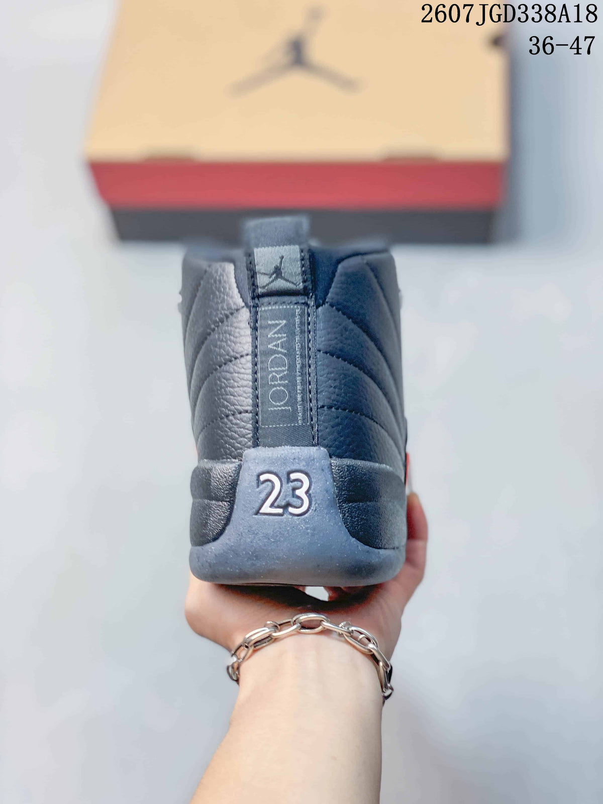 Rear view of the sneaker showing the Jordan heel detail, padded collar, and the number 23.