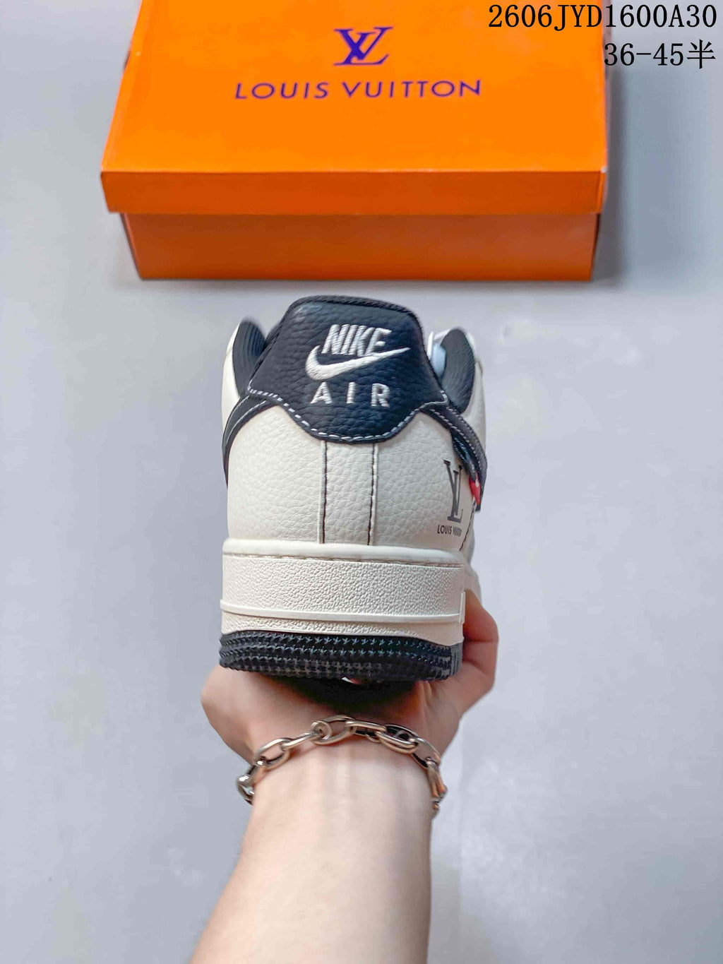 Rear view showing the white heel, dark heel panel, and contrasting outsole