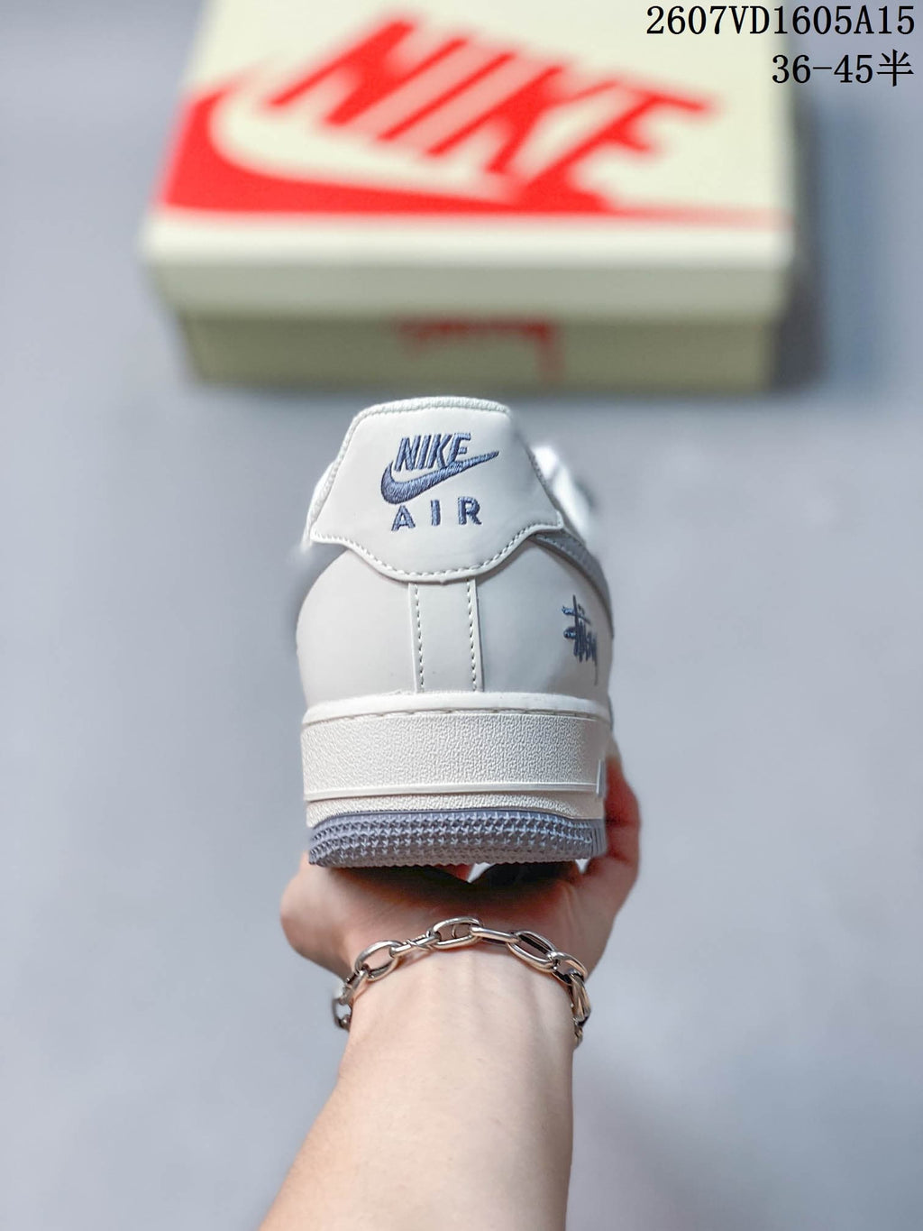 Rear view of the sneaker showing the Nike Air heel branding, grey outsole edge, and padded collar.
