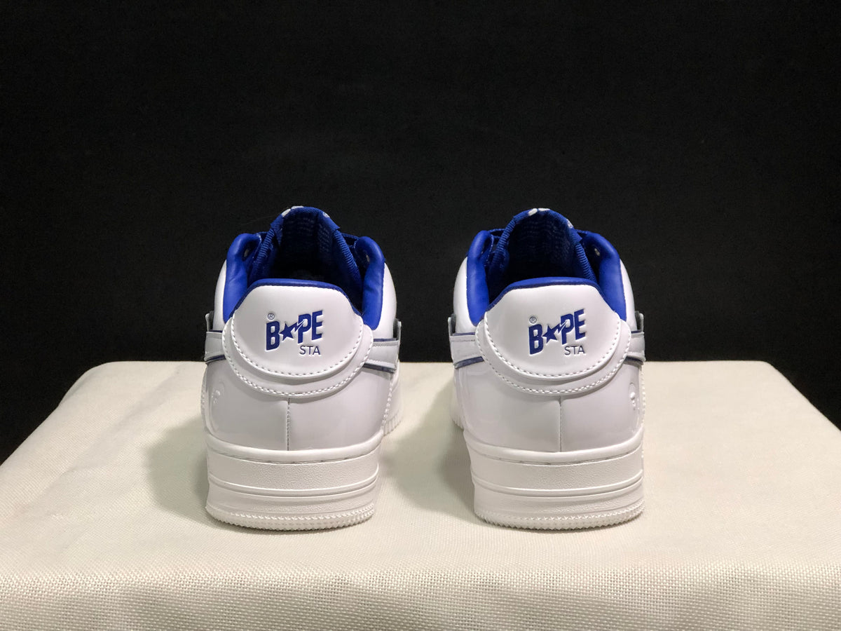Rear view of the pair showing BAPE STA heel branding and blue padded collars.