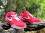 Pink Nike Kobe 4 shoes photographed from front and side angles.
