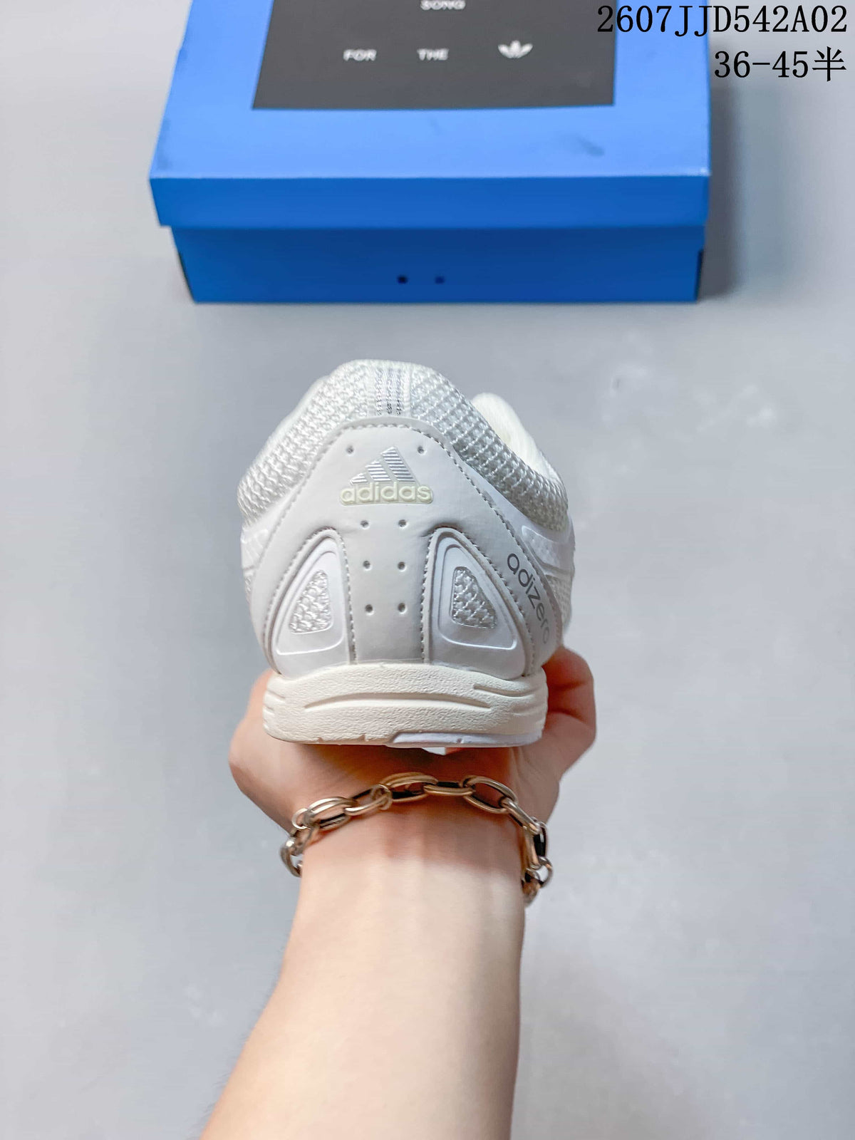 Rear view of the white sneaker showing its heel details and Adidas branding.