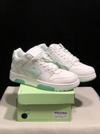 Pair of white and pale mint low-top sneakers displayed on a light green shoebox; the box label shows size 41.