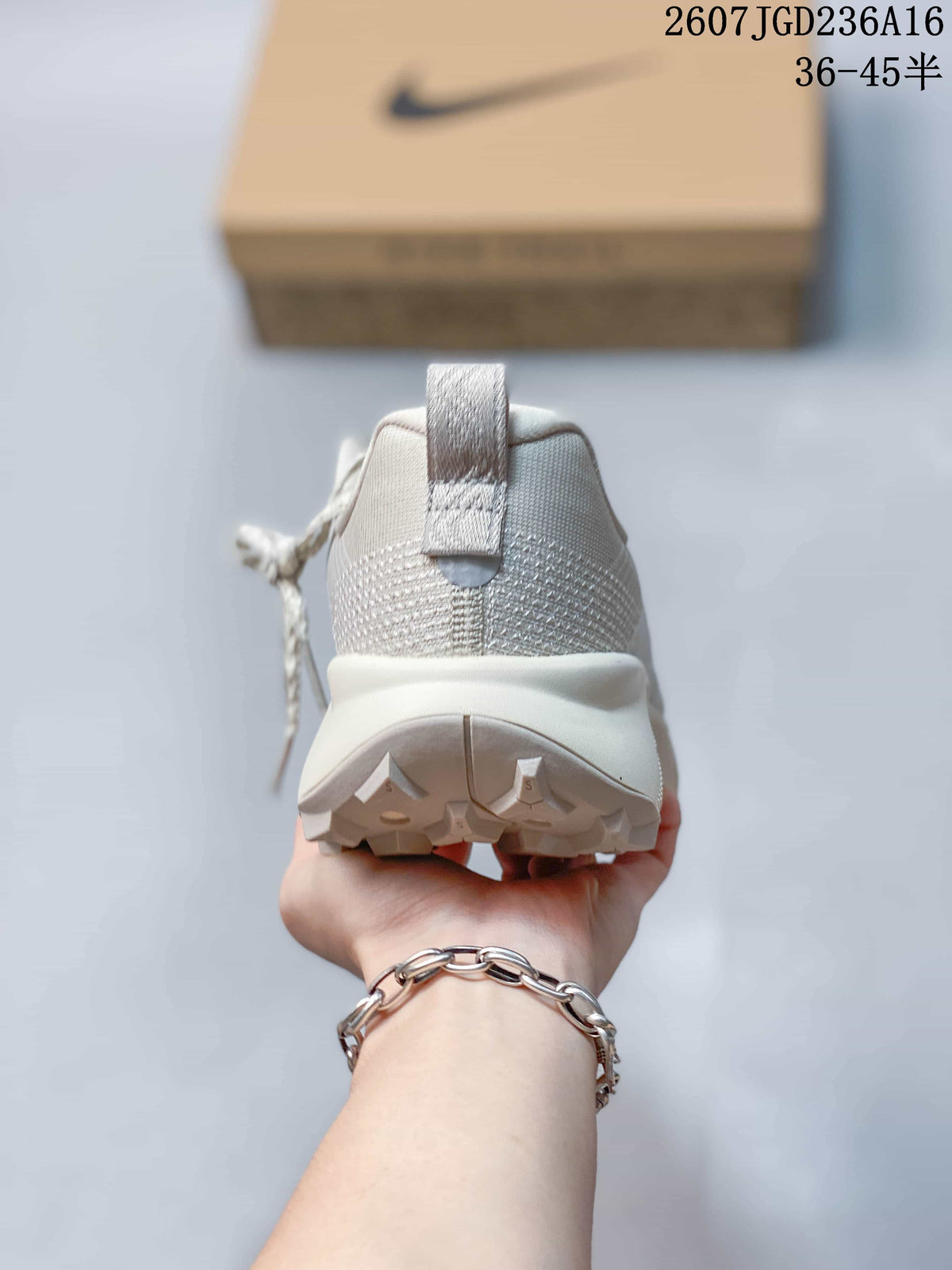 Rear view of the shoe showing the padded heel collar, pull tab, white midsole, and textured outsole.