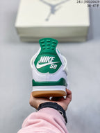 Rear view of a white sneaker with a green heel tab, green heel accent, and visible Nike SB branding.