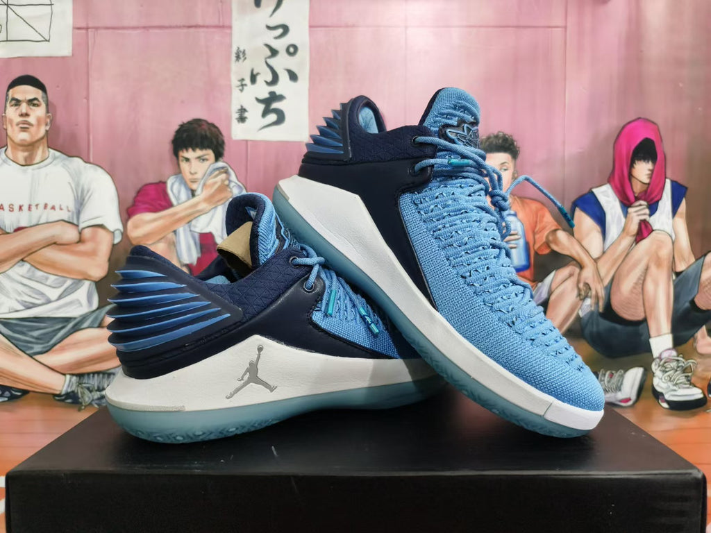 Pair of blue and navy Jordan XXX2 basketball shoes displayed together
